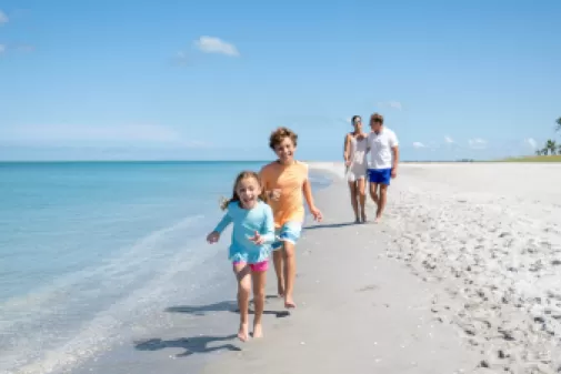 Family reconnecting on the beach