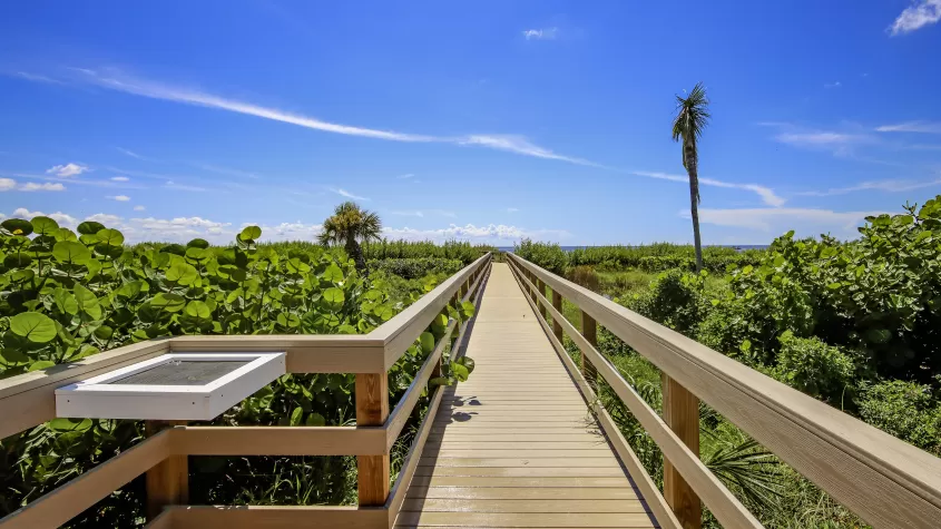 Boardwalk out to beach at at Sanibel Arms West Condos